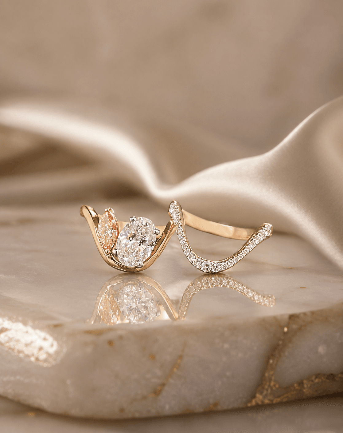 A Carat Amor toi-et-moi ring pairing a white oval and a pink marquise diamond.